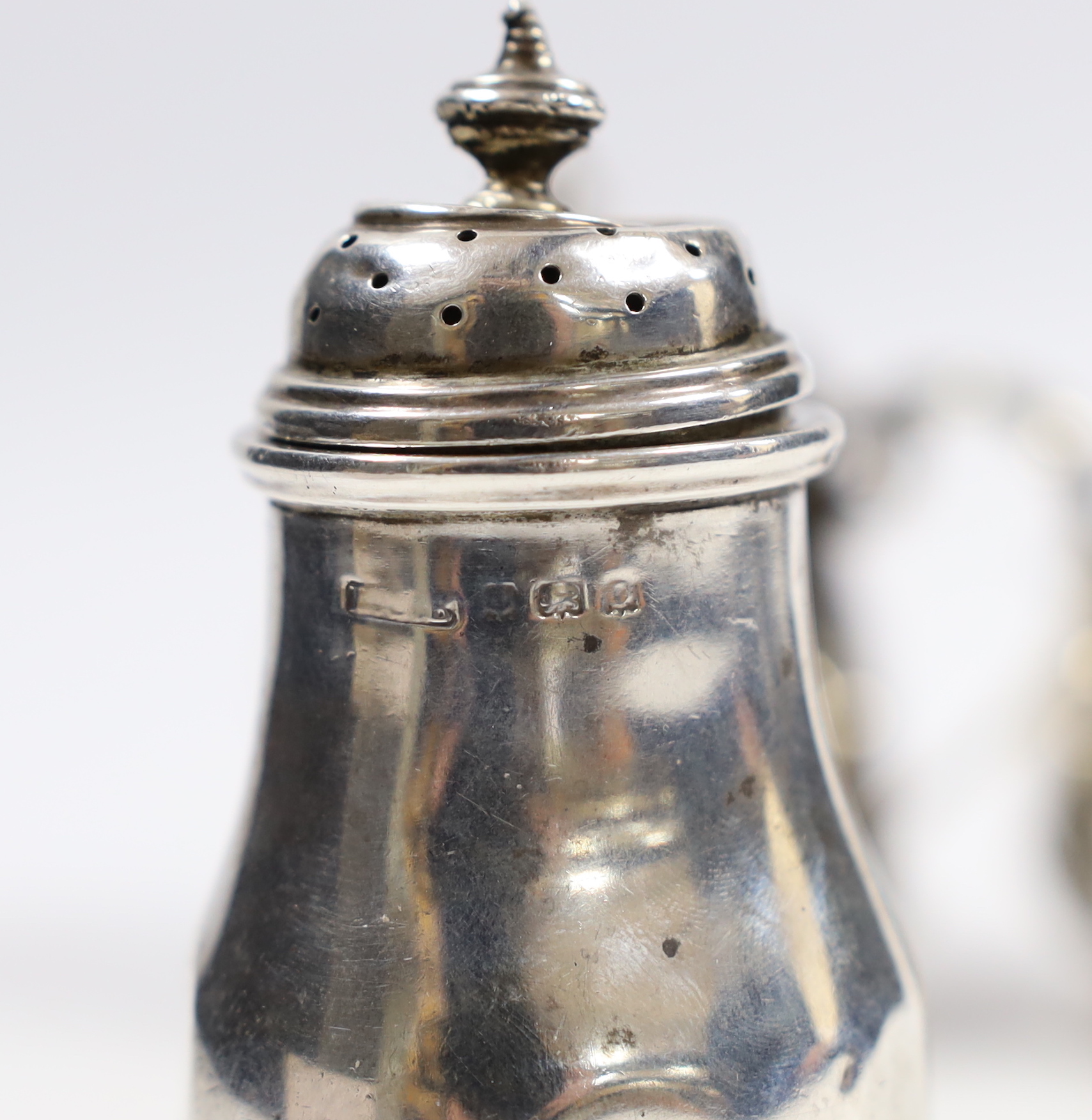 A George V silver oval three piece condiment set, Birmingham, 1913, lacking spoons.